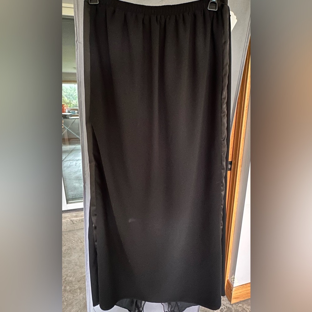 Beautiful skirt w/satin trim and ruffles in back slit! New/Never worn! Size XL.